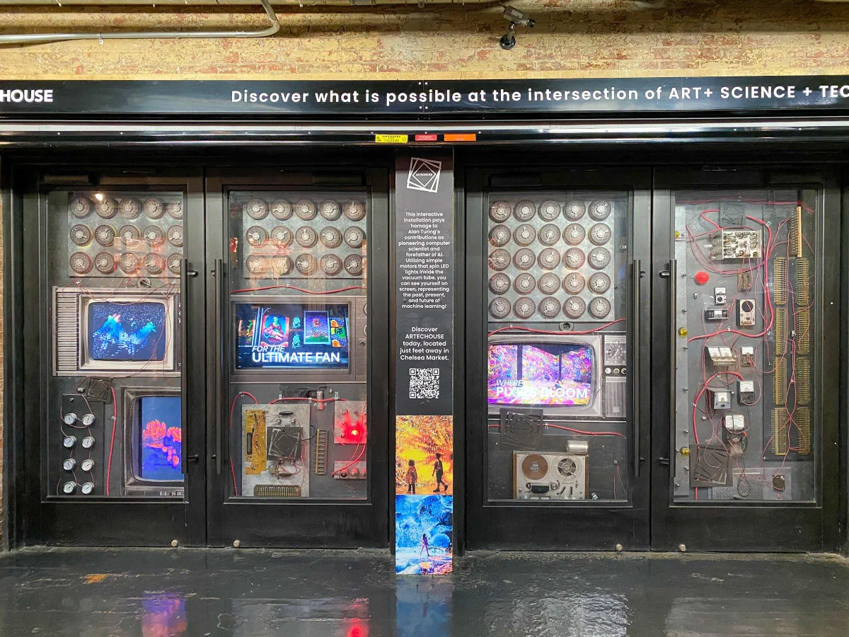An ornate storefront with decorated windows and a row of colorful posters.